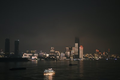 white and black boat on water during night time